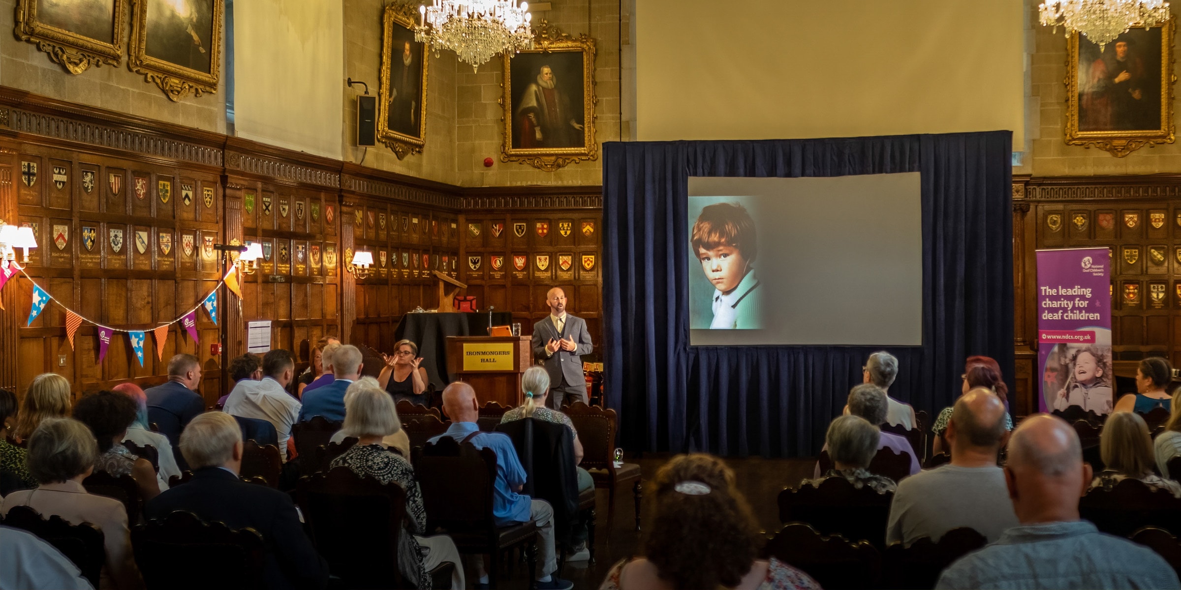 Carl Morris delivering a motivational talk at Ironmongers' Hall, London
